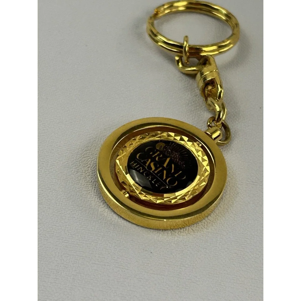 Vintage Grand Casino Mille Lacs Gold Tone Spinner Keychain Fob Souvenir